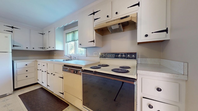 10 Freeman Rd, Yarmouth Port, MA 02675 - kitchen with white appliances, under cabinet range hood, light countertops, and white cabinetry