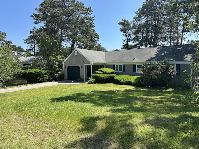 10 Freeman Rd, Yarmouth Port, MA 02675 - ranch-style house with driveway, an attached garage, and a front lawn