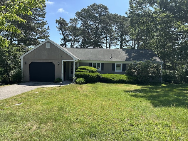 10 Freeman Rd, Yarmouth Port, MA 02675 - single story home with an attached garage, driveway, and a front lawn