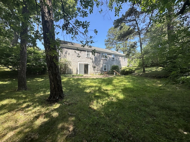 10 Freeman Rd, Yarmouth Port, MA 02675 - rear view of property featuring a yard