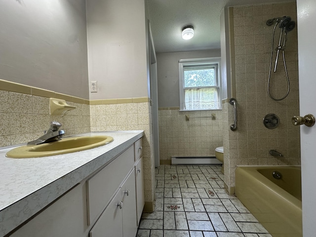 10 Freeman Rd, Yarmouth Port, MA 02675 - full bath featuring a baseboard heating unit, tile walls, vanity,  shower combination, and a wainscoted wall