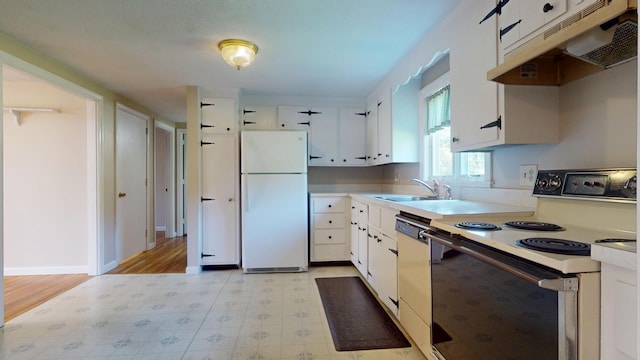 10 Freeman Rd, Yarmouth Port, MA 02675 - kitchen featuring white appliances, under cabinet range hood, light countertops, light floors, and white cabinets