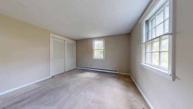 10 Freeman Rd, Yarmouth Port, MA 02675 - unfurnished bedroom with baseboard heating, carpet, and a closet