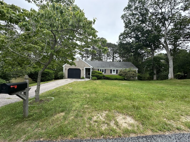 10 Freeman Rd, Yarmouth Port, MA 02675 - ranch-style house featuring driveway, an attached garage, and a front lawn