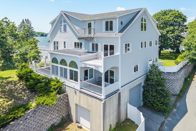 12 Groveland St, Buzzards Bay, MA 02532 - back of property featuring a balcony and an attached garage