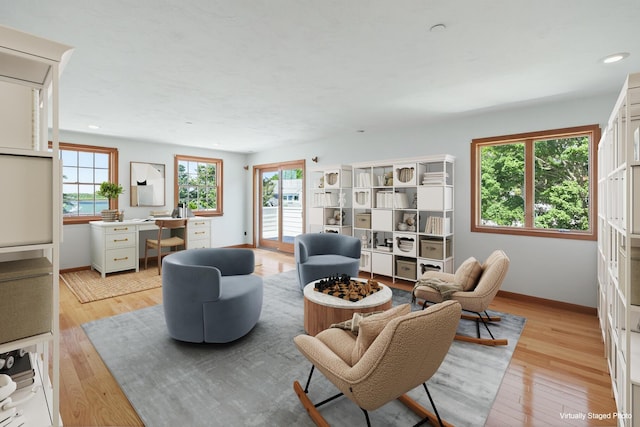 12 Groveland St, Buzzards Bay, MA 02532 - living room featuring healthy amount of natural light, light wood finished floors, recessed lighting, and a desk