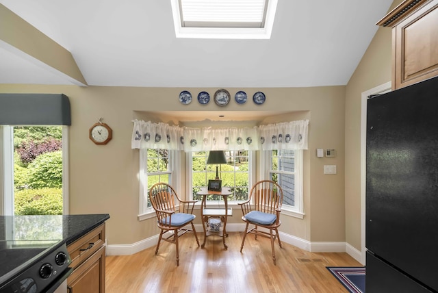 4 Square Rigger Ln, Hyannis, MA 02601 - living area with light wood-style floors, lofted ceiling, and a skylight