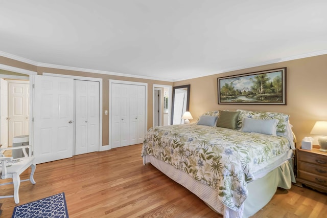 4 Square Rigger Ln, Hyannis, MA 02601 - bedroom with multiple closets, light wood-style flooring, and ornamental molding