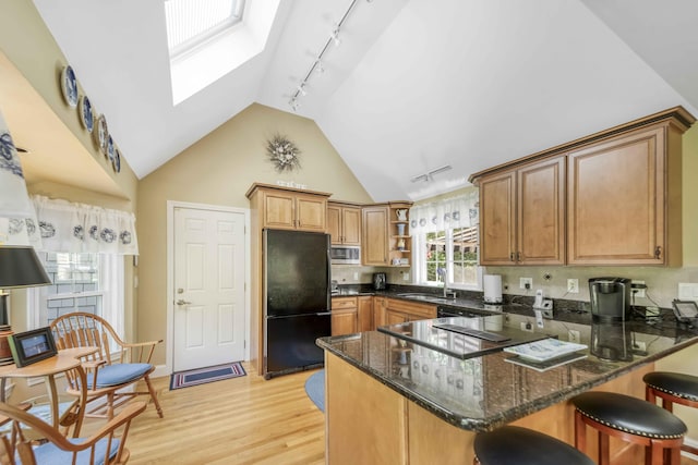 4 Square Rigger Ln, Hyannis, MA 02601 - kitchen featuring freestanding refrigerator, stainless steel microwave, rail lighting, a peninsula, and open shelves