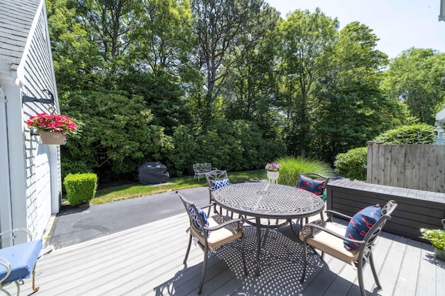 4 Square Rigger Ln, Hyannis, MA 02601 - deck with outdoor dining space, area for grilling, and view of wooded area