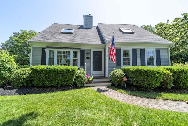 4 Square Rigger Ln, Hyannis, MA 02601 - view of front of house with a chimney, a front lawn, and roof with shingles