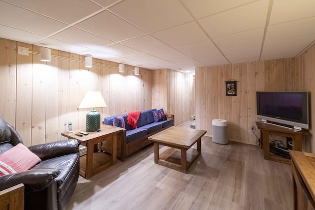 4 Square Rigger Ln, Hyannis, MA 02601 - living area featuring light wood finished floors, a drop ceiling, and wood walls