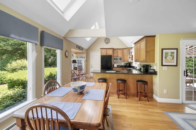 4 Square Rigger Ln, Hyannis, MA 02601 - dining space with a skylight, plenty of natural light, light wood-style floors, and high vaulted ceiling