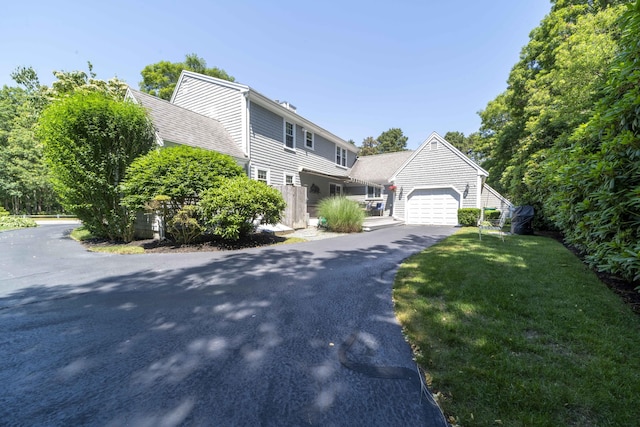 4 Square Rigger Ln, Hyannis, MA 02601 - view of front of property with a garage, driveway, and a front lawn