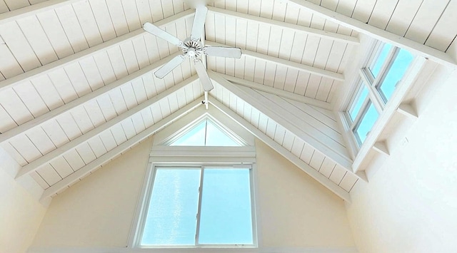 bonus room with a healthy amount of sunlight, lofted ceiling with beams, and ceiling fan