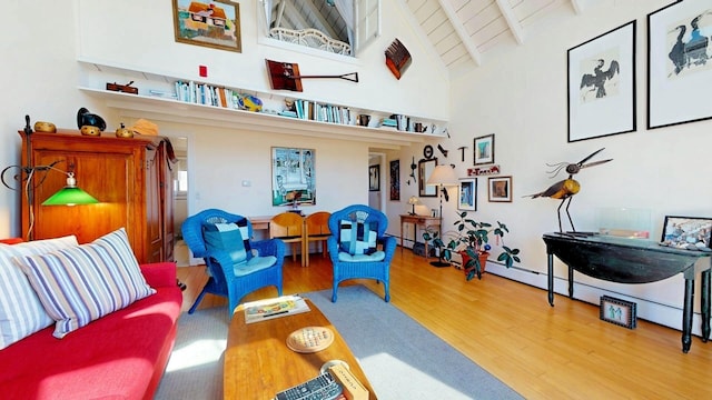 living area with beamed ceiling, hardwood / wood-style floors, wooden ceiling, and high vaulted ceiling