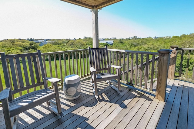 deck featuring a lawn