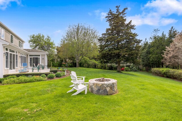46 Freeman Ln, Orleans, MA 02653 - view of green lawn featuring a fire pit and a patio area