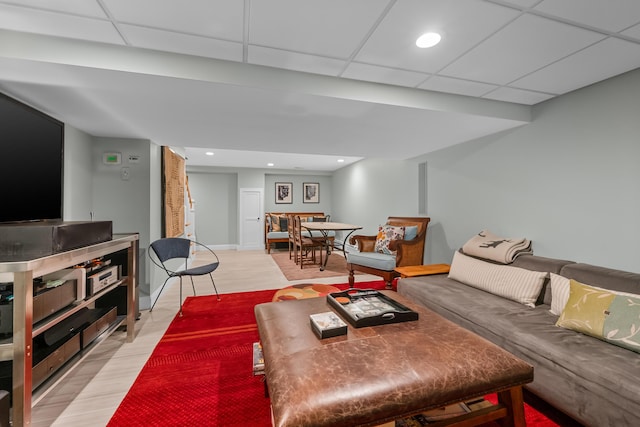 living room featuring a drop ceiling