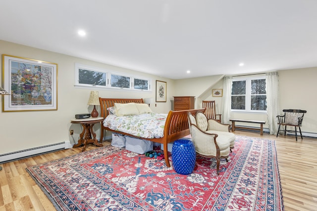 bedroom featuring a baseboard radiator and hardwood / wood-style floors