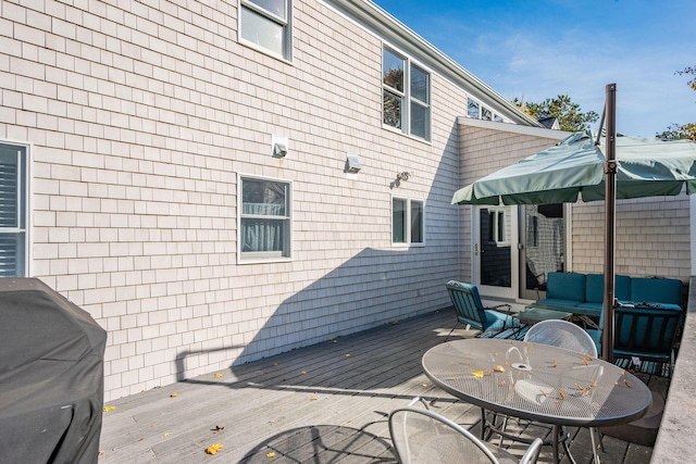 deck featuring area for grilling and an outdoor living space