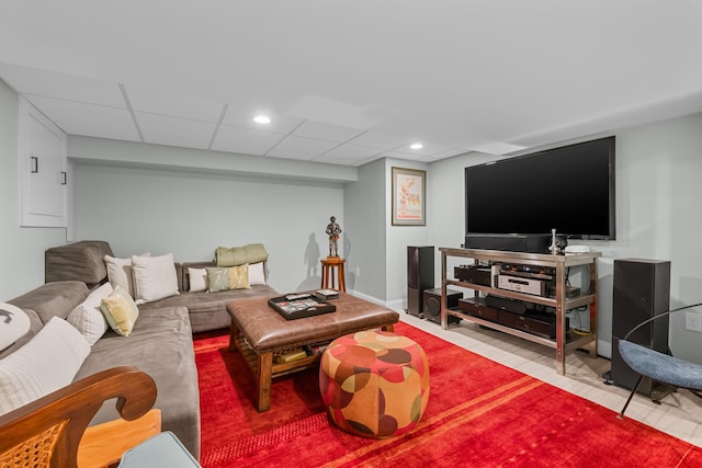 living room featuring a drop ceiling