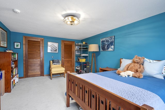 bedroom featuring a closet and light carpet