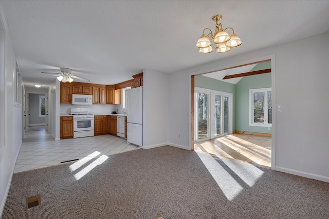 4 Inkberry Cir, Sandwich, MA 02563 - kitchen with baseboards, light carpet, white appliances, light countertops, and lofted ceiling
