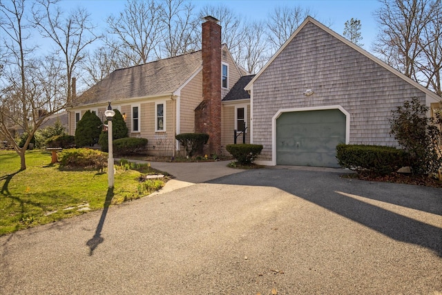 4 Inkberry Cir, Sandwich, MA 02563 - cape cod-style house featuring a front yard, an attached garage, driveway, and roof with shingles
