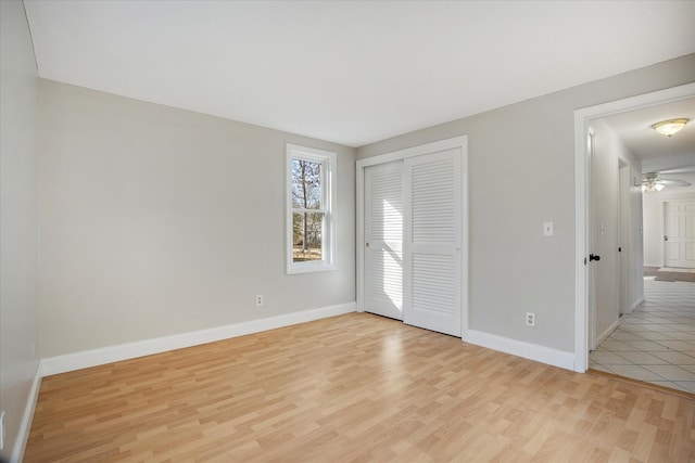 4 Inkberry Cir, Sandwich, MA 02563 - empty room featuring light wood finished floors, baseboards, and a ceiling fan
