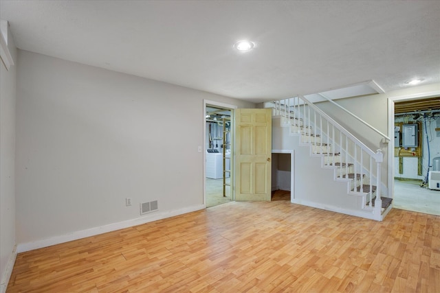 4 Inkberry Cir, Sandwich, MA 02563 - finished below grade area with visible vents, stairway, wood finished floors, and electric panel