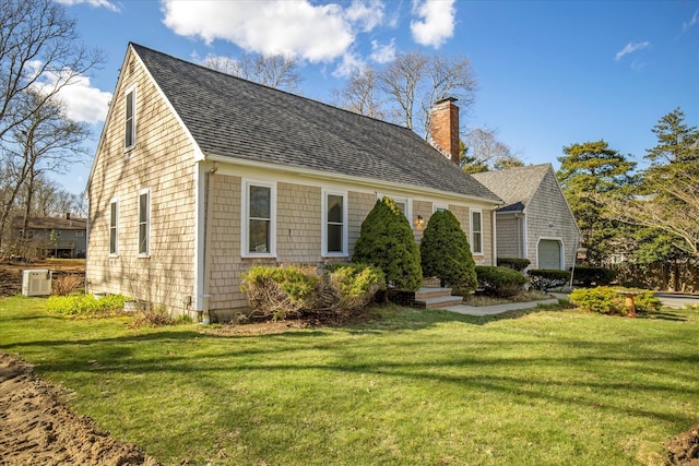 4 Inkberry Cir, Sandwich, MA 02563 - view of front of property with a shingled roof, a chimney, and a front lawn
