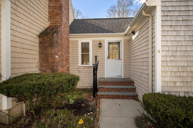 4 Inkberry Cir, Sandwich, MA 02563 - doorway to property featuring a shingled roof and a chimney
