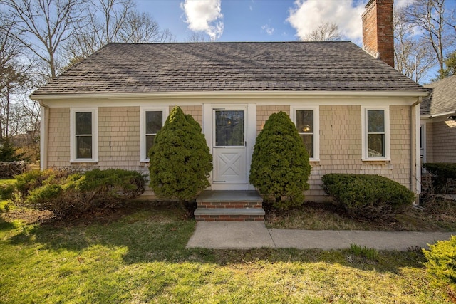 4 Inkberry Cir, Sandwich, MA 02563 - bungalow-style house with a front yard, roof with shingles, and a chimney
