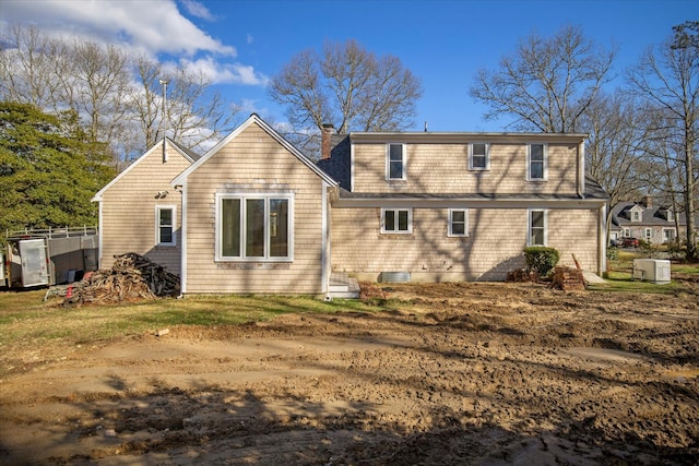 4 Inkberry Cir, Sandwich, MA 02563 - rear view of property featuring a chimney