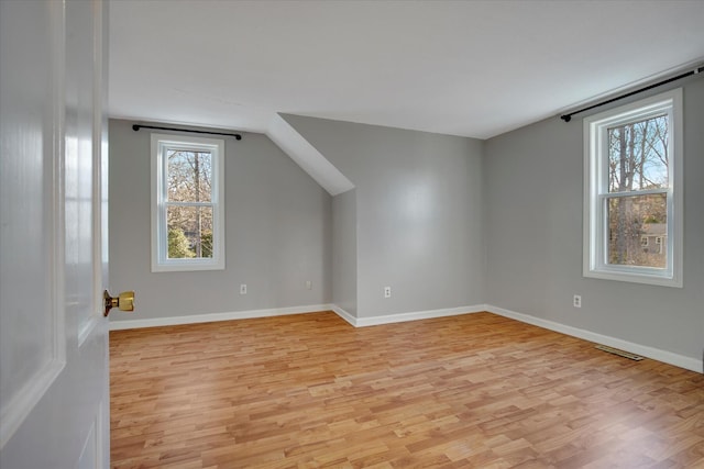 4 Inkberry Cir, Sandwich, MA 02563 - bonus room with vaulted ceiling, visible vents, light wood-type flooring, and baseboards
