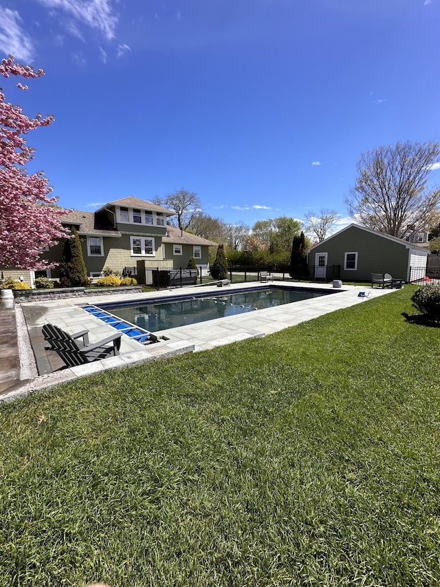 view of pool featuring a patio area and a lawn