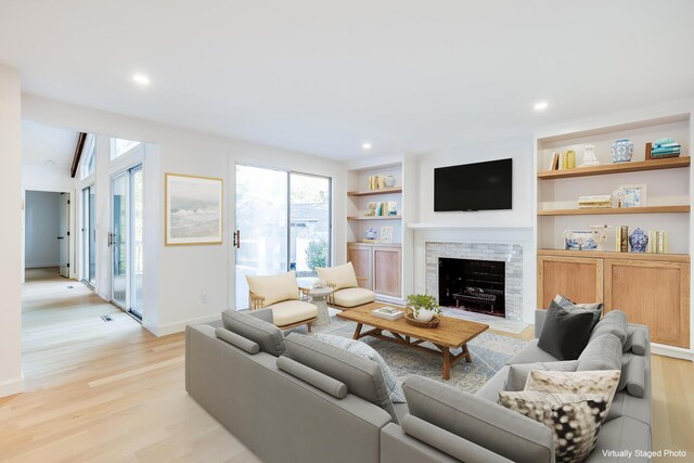 unfurnished living room with track lighting, light wood-type flooring, wood ceiling, and vaulted ceiling with beams