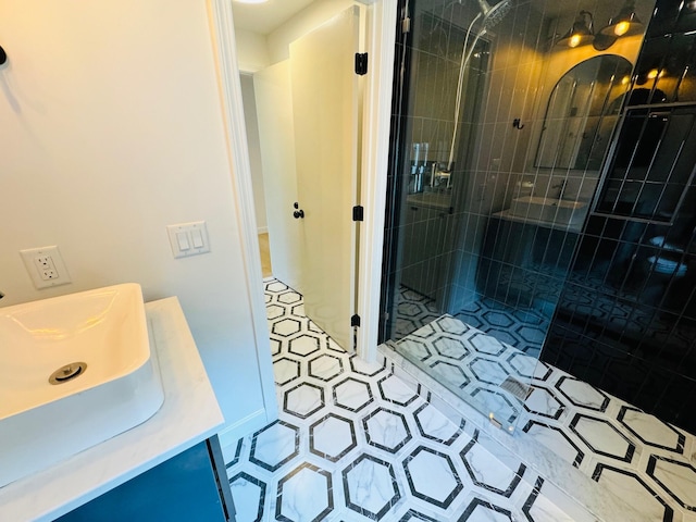 bathroom featuring vanity and a tile shower