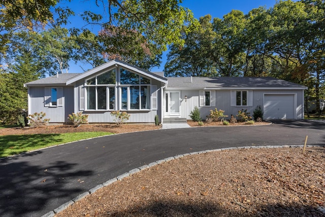 single story home featuring a garage