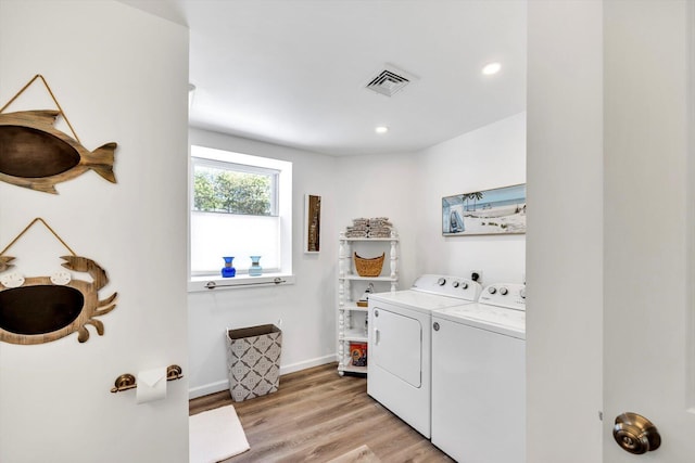 39 Nehoiden Rd, Mashpee, MA 02649 - laundry room with washer and clothes dryer, light wood-type flooring, baseboards, and recessed lighting