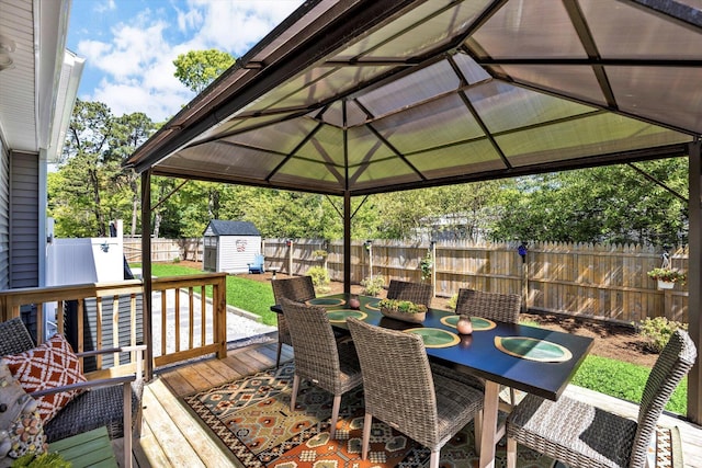 39 Nehoiden Rd, Mashpee, MA 02649 - wooden deck with a gazebo, a fenced backyard, and outdoor dining space