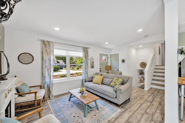 39 Nehoiden Rd, Mashpee, MA 02649 - living area with light wood-type flooring, recessed lighting, stairway, and baseboards
