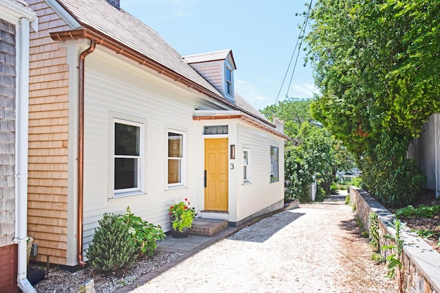 3 Carver Ct, Provincetown, MA 02657 - view of exterior entry featuring a shingled roof
