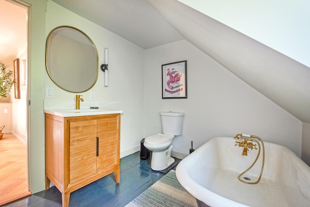 3 Carver Ct, Provincetown, MA 02657 - bathroom featuring a freestanding tub, vanity, and vaulted ceiling