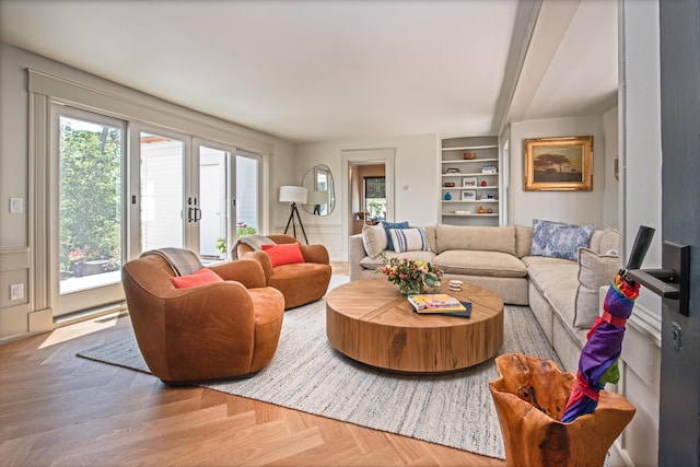 3 Carver Ct, Provincetown, MA 02657 - living room featuring built in shelves and beam ceiling