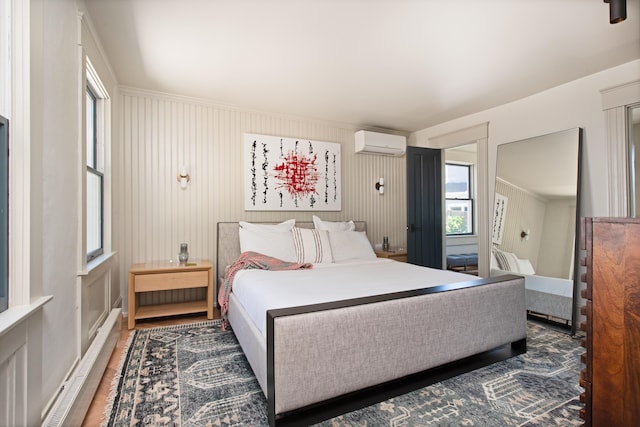 3 Carver Ct, Provincetown, MA 02657 - bedroom with a wall mounted air conditioner and wood finished floors