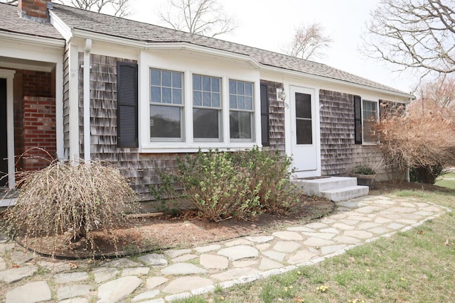entrance to property featuring a chimney