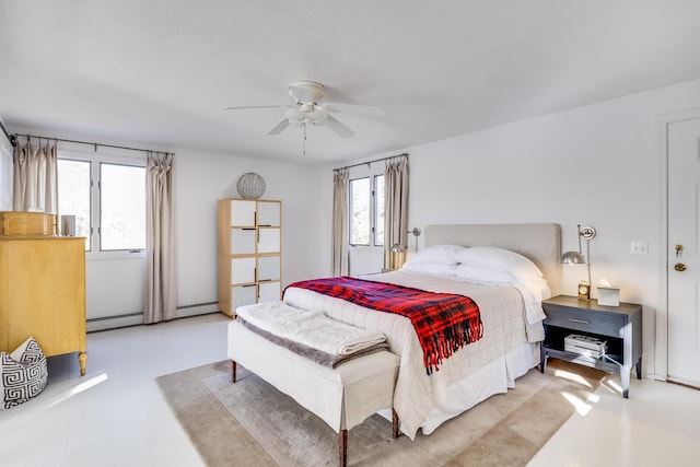 bedroom with baseboard heating and a ceiling fan