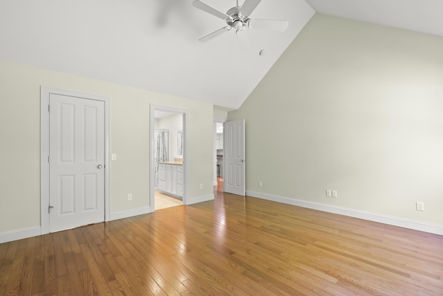 21 Pine St Unit 1Au, North Falmouth, MA 02556 - unfurnished bedroom with high vaulted ceiling, light wood-style flooring, ensuite bath, and ceiling fan